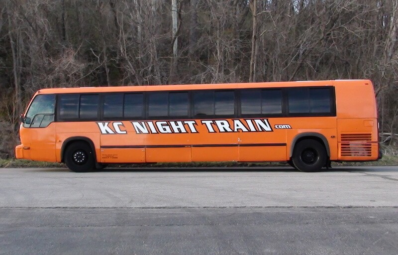 Driver's side of Orange Party Bus