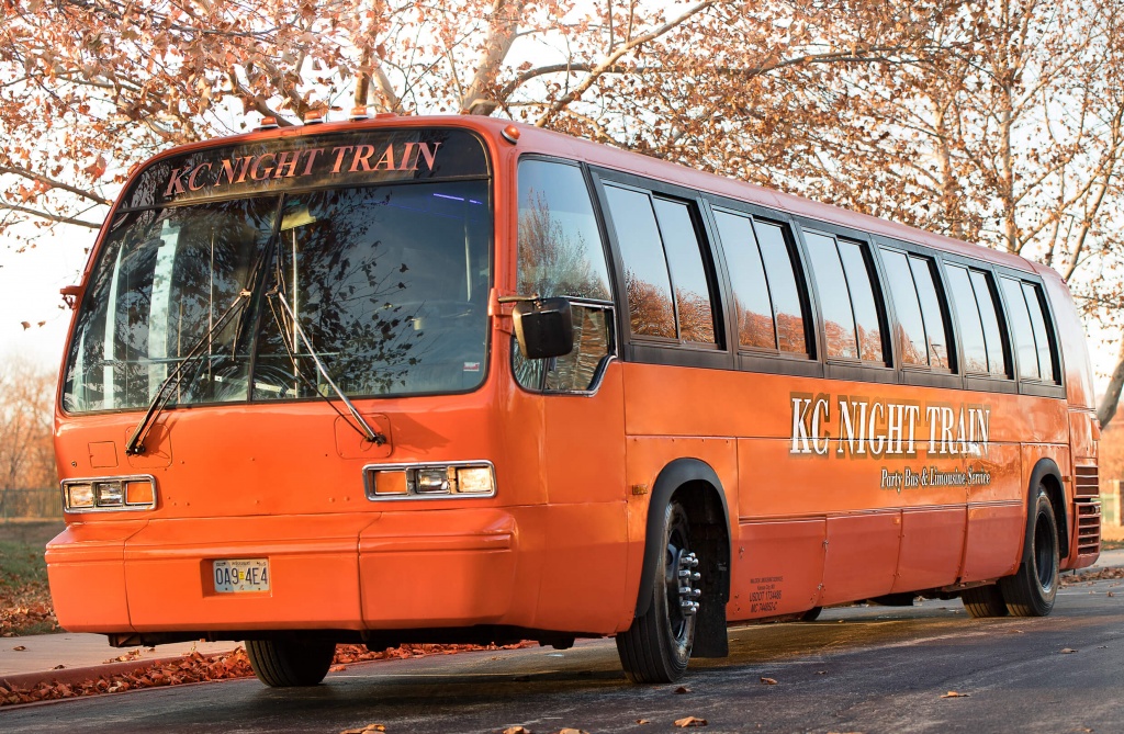 Orange Party Bus (Exterior, Front, Driver’s Side)