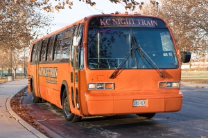 Orange Party Bus (Exterior, Front, Passenger Side)